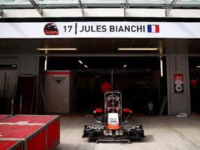 Jules Bianchi of France and Marussia's name are displayed above his side of the team garage  ahead of the Russian Grand Prix on Oct. 8, 2014.