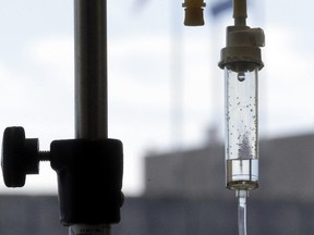 In this Sept. 5, 2013 file photo, an infusion drug to treat cancer is administered to a cancer patient via intravenous drip at Duke Cancer Center in Durham, N.C.