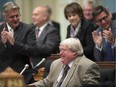 Quebec Health Minister Gaetan Barrette is applauded by his colleagues after he tabled legislation on health and social services Thursday, September 25, 2014 at the legislature in Quebec City.