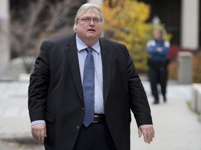Quebec Health Minister Gaetan Barrette arrives to attend a cabinet meeting, Wednesday, September 24, 2014 at the legislature in Quebec City.