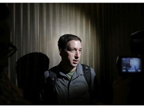 Glenn Greenwald, a reporter of The Guardian, speaks to reporters at his hotel in Hong Kong Monday, June 10, 2013. Greenwald reported a 29-year-old contractor who claims to have worked at the National Security Agency and the CIA allowed himself to be revealed Sunday as the source of disclosures about the U.S. government's secret surveillance programs, risking prosecution by the U.S. government.