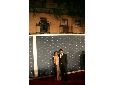 Guatemalan actress Karen Martinez and Spanish director Diego Quemada-Diez pose for photographers during their red carpet walk during the Fenix Iberoamerican Film awards at the Esperanza Iris Theater in Mexico City, Thursday Oct. 30, 2014.