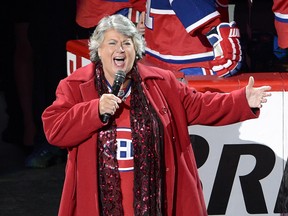 Ginette Reno sings the national anthems before game three of the National Hockey League second round Stanley Cup playoffs between the Boston Bruins and the Montreal Canadiens Tuesday, May 6, 2014 in Montreal.
