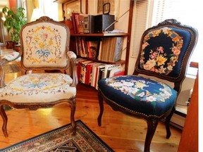 Armchairs upholstered with petit point embroidery, courtesy of her former mother-in-law in Renee Lescop's condo Thursday, August 28, 2014 in Montreal. Her ground floor condo is one of a group of apartments built a century ago.