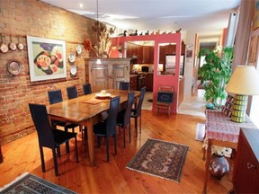 Dining room area , featuring a refectory table in Renee Lescop's condo Thursday, August 28, 2014 in Montreal. Her ground floor condo is one of a group of apartments built a century ago.