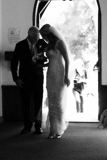 A pause, moments before walking down the aisle.