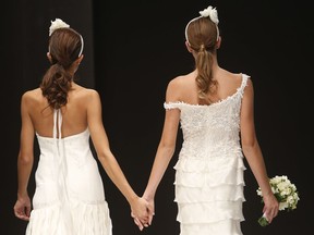Models on the catwalk during a wedding fashion show with same-sex couples, dubbed "The rainbow wedding fashion show", part of a wedding fair that took place in Rome in October 2014.