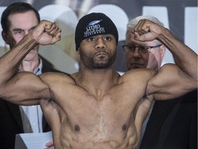 Jean Pascal flexes his muscles during a weigh-in on Jan. 17, 2014 in Montreal.