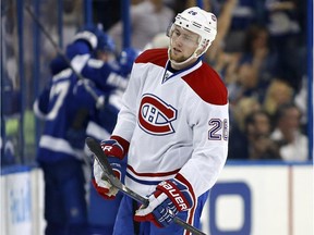 The Canadiens' Jiri Sekac reacts as Tampa Bay players celebrate a goal during the first period of a 7-1 Lightning victory on Oct. 13, 2014, in Tampa, Fla.