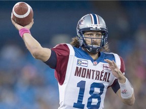 Montreal Alouettes quarterback Jonathan Crompton launches a pass against the Toronto Argonauts during first-half CFL action in Toronto on Saturday October 18, 2014.