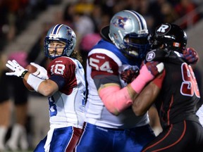 Montreal Alouettes' Jonathan Crompton lines up a pass as he takes on the Ottawa Redblacks during CFL action in Ottawa on Friday Oct 24, 2014.