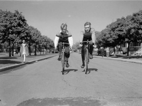 June 4, 1939: Norman Wilkins (left) and Dennis Murch cycle in Verdun, near the Wolfe Cycle Club.