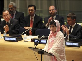 In this file photo dated Friday, July 12, 2013, United Nations Secretary-General Ban Ki-moon, left, applauds as Malala Yousafzai addresses the Malala Day Youth Assembly, at United Nations headquarters. Malala Yousafzai, the Pakistani teenager shot by the Taliban for promoting education for girls, celebrated her 16th birthday on Friday addressing the United Nations. The U.N. has declared July 12 "Malala Day," to honor the teen who returned to school in March after medical treatment in Britain for injuries suffered in the October attack. Teenage activist Malala Yousafzai has jointly won the Nobel Peace Prize for her "heroic struggle" for girls' rights to education, it is announced Friday Oct. 10, 2014.