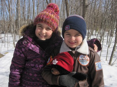 Selina and Julian enjoy the last of the snow on a stroll through the nature park in Ile-Bizard.