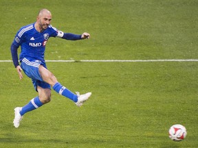 Montreal Impact's Marco Di Vaio scores against D.C. United during an MLS soccer game in Montreal, Saturday, October 25, 2014.