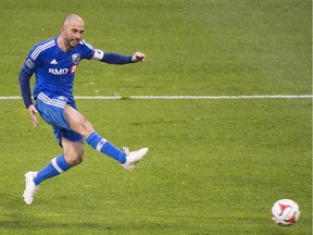Montreal Impact's Marco Di Vaio scores against D.C. United during an MLS soccer game in Montreal, Saturday, October 25, 2014.