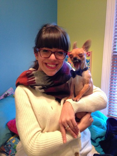 All dressed up, my Chihuahua Tuco makes a strange face while yawning. My daughter Coralie is holding him.