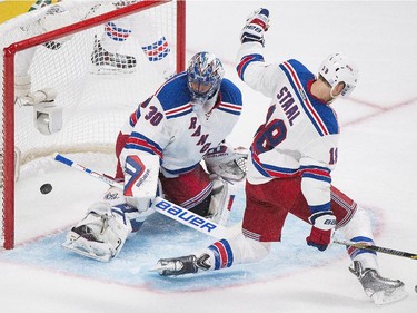 New York Rangers goaltender Henrik Lundqvist (30) is scored on by Montreal Canadiens' Max Pacioretty (not shown) as Rangers' Marc Staal (18) defends during third period NHL hockey action in Montreal, Saturday, October 25, 2014.