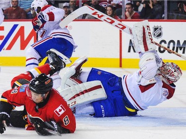 Joe Colborne of the Calgary Flames got two minutes for interference on goalkeeper after colliding with Carey Price at Scotiabank Saddledome on Tuesday, Oct. 28, 2014, in Calgary.