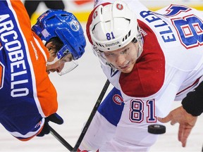 The Canadiens' Lars Eller and the Oilers' Mark Arcobello square off in faceoff circle during NHL game in Edmonton on Oct. 27, 2014. The Oilers won the game 3-0.