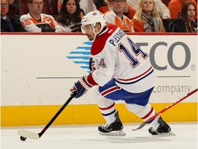 Tomas Plekanec #14 of the Montreal Canadiens takes the puck in the third period against the Philadelphia Flyers on October 11, 2014.