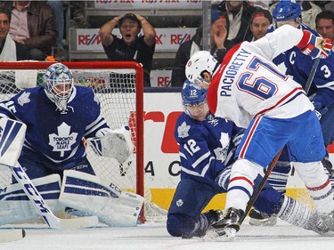 TORONTO, ON - OCTOBER 8:  Max Pacioretty #67 of the Montreal Canadiens battles against Stephane Robidas #12 of the Toronto Maple Leafs in their NHL season opener at the Air Canada Centre on October 8, 2014 in Toronto, Ontario, Canada.