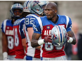 Montreal Alouettes reciever Chad Johnson puts his helmet on during warmup prior to Canadian Football League game against the Ottawa Red blacks in Montreal August 29, 2014.