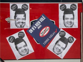 Posters of Montreal Mayor Denis Coderre on the door of a fire truck in protest of the proposed Bill 3, a pension reform bill.