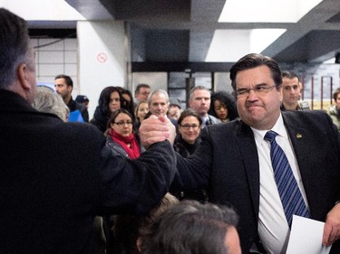 Dec. 16, 2013: Montreal Mayor Denis Coderre greets people gathered to attend a press conference.