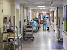 Nurses speak in the hallway at the Balfour M. Mount Palliative Care Unit of the Montreal General Hospital in Montreal on Monday, February 10, 2014.