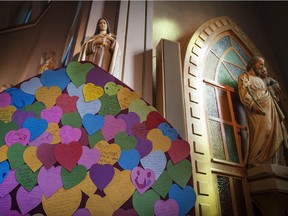 Words of support and grief written by well wishers and family, were put on the alter at Ste-Agnés church in Lac Mégantic July 15, 2013.