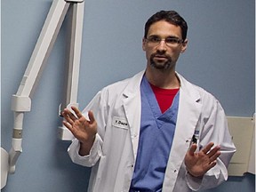 Pathologist Yann Daze, of the Quebec forensic lab, speaks to reporters in Montreal June 4, 2014.