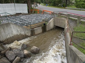 The crippled dam at Pine Lake in Hudson.