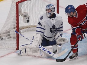 Canadiens forward Brendan Gallagher watches shot by P.K. Subban go past Toronto Maple Leafs goalie Jonathan Bernier during NHL action in Montreal on March 01, 2014.