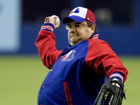 March 28, 2014: Denis Coderre throws the first pitch during a pre-season Major League Baseball game between the New York Mets and the Toronto Blue Jays at the Olympic Stadium in Montreal.