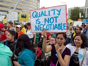 Protesters show up on Saturday May 11, 2013 for demo against the provincial governments planned budget cuts in the daycare system .