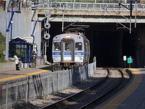 A train exits the tunnel  at the Canora station in Town of Mount Royal area of Montreal, Tuesday, May 14, 2013.