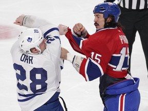 The Canadiens' George Parros and Colton Orr of the Toronto Maple Leafs fight during game at the Bell Centre on Nov. 30, 2013.