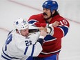 The Canadiens' George Parros fights with Toronto Maple Leafs' Colton Orr during game at the Bell Centre on Oct. 1, 2013.