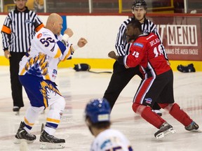 Brandon Christian of the Laval Prédateurs (left) and Samuel Duplain of Saint-Georges Cool FM square off to fight at the Colisée de Laval in a Ligue Nord Américaine de Hockey game on Oct. 12, 2014. Though fighting is still a feature of semi-pro games, the number of them are a lot less than what they were in previous years.
