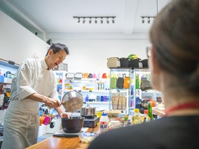 Chef and teacher Mikio Owaki prepares rice at a class on bento meals at the Lunch-à-Porter store in Montreal on Thursday, October 16, 2014.