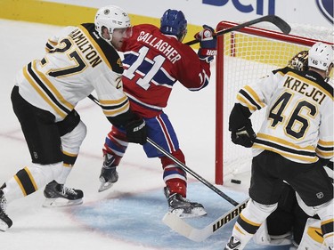 Montreal Canadiens Brendan Gallagher scores a second period goal against Boston Bruins Dougie Hamilton, goalie Tuukka Rask and David Krejci during National Hockey League game in Montreal Thursday October 16, 2014.