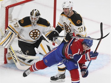 Montreal Canadiens Brendan Gallagher gets roughed up by Boston Bruins Zdeno Chara, 33, in front of goalie Niklas Svedberg during National Hockey League game in Montreal Thursday October 16, 2014.