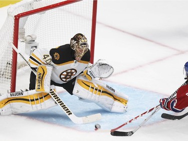 Montreal Canadiens David Desharnais has the puck knocked off his stick by Boston Bruins defenceman Zdeno Chara, 33, in front of goalie Tuukka Rask during National Hockey League game in Montreal Thursday October 16, 2014.