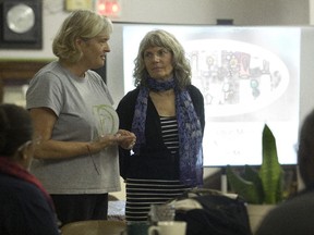 Kathryn Aitken and Jane Barr, members of the Transition N.D.G. initiative, participate in a potluck event at the N.D.G. Food Depot in October 2014.
