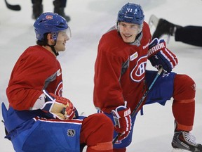 Max Pacioretty (left) and Brendan Gallagher talk during Canadiens practice at the Bell Sports Complex in Brossard on Oct. 17, 2014.