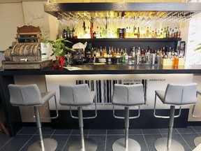 Besides a handsome bar, Code Ambiance features elegant, high-back chairs, wide tables, and a glassed-in wine cellar.