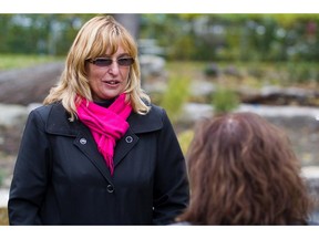 Louise De Sousa, mother of Anastasia De Sousa, the woman fatally wounded in the 2006 Dawson College shooting, is seen at the the "Peace Garden" on the Dawson College campus in Montreal on Monday, Oct. 18, 2010.