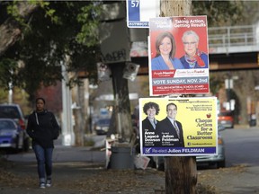 Signs for the November 2, 2014 English school board elections show opposing candidates at the corner of Knox and Charlevoix in Montreal.