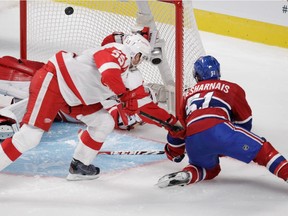 David Desharnais  of the Montreal Canadiens watches his overtime-winning goal get past goalie Jimmy Howard of the Detroit Red Wings in NHL action at the Bell Centre in Montreal on Tuesday, October 21, 2014.